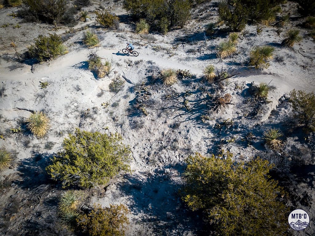 Mountain biker descending The Chutes trail on 50 Year Golder Ranch Trail Network Tucson Arizona