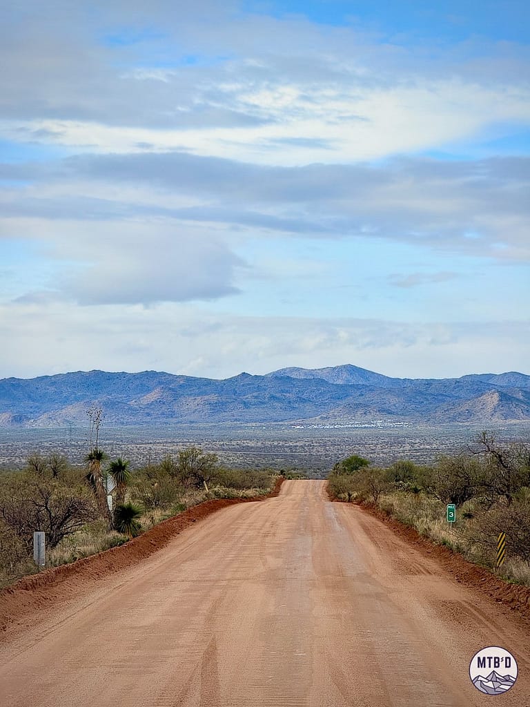 Willow Springs Road stretching toward 24 Hour Town at the base of the Black Mountains near Oracle, Arizona — venue for 24 Hours in the Old Pueblo